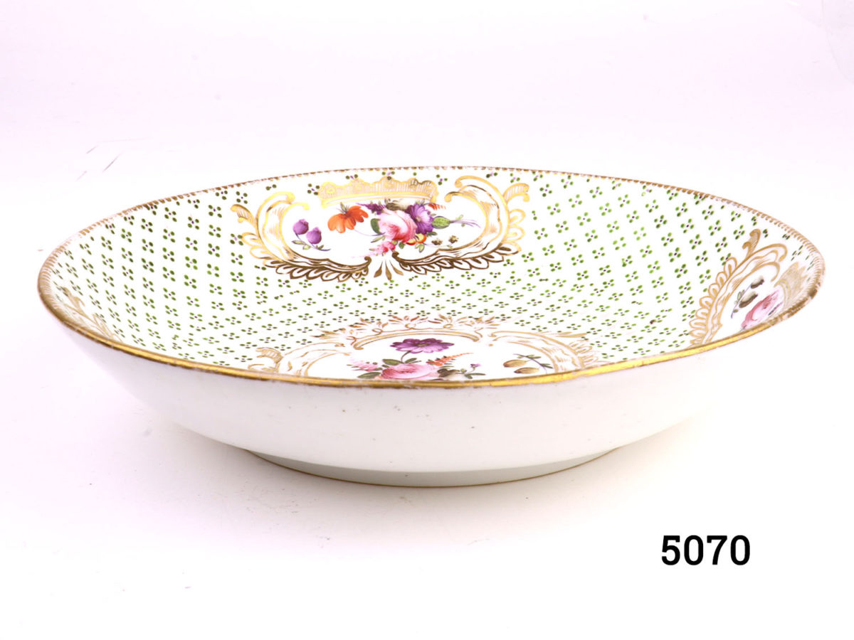 Antique early Coalport shallow dish hand-painted with flowers and gilt with debossed green pattern throughout. Measures 100mm in diameter at base and 170mm across the top. Main photo showing depth of both with plain white exterior and decorative interior