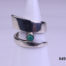 Modernist style vintage silver ring. Vintage sterling silver ring in an asymmetrical twist design with single small turquoise stone accent Size M.5 / 6.5 Main photo showing ring front displayed on a stand