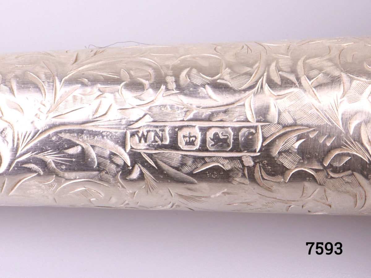 Antique Victorian sterling silver cheroot case with vacant cartouche for personalisation set in intricate scrollwork Hallmarked WN with a lion passant inside the lid (Currently housing small pencils) Close up photo of the hallmark
