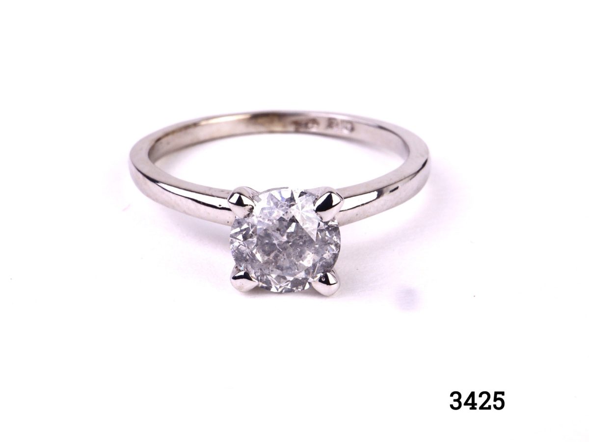 Front view of vintage round brilliant cut solitaire diamond white gold ring.