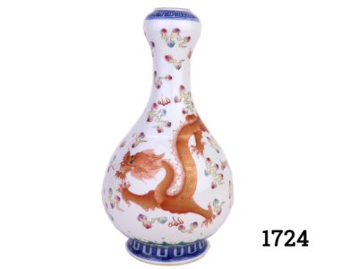 A vintage Chinese bulbous thin necked vase on green, blue and white ground. Hand-painted with a golden red dragon to one side and green and pink phoenix on the other symbolising success and prosperity. Stamped to the base. Measures 80mm in diameter at base and 30mm in diameter at opening at top. Main photo showing the dragon side of vase