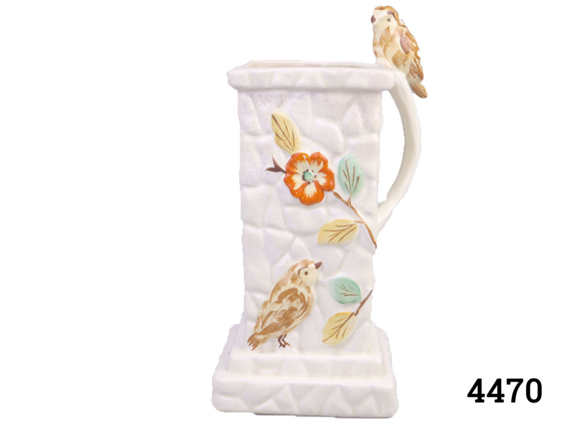 1930s Wintertons hand-painted jug with bird figurine on handle. Base measures 115mm square Main photo showing side of jug with bird painted on and bird on handle looking forward