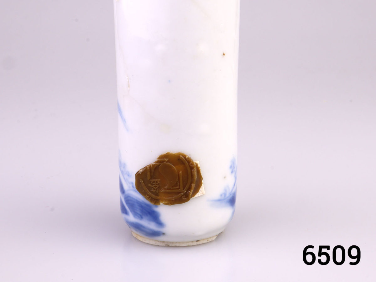 19th century blue & white Chinese snuff bottle decorated with an official on horseback galloping across the sea. Turquoise topped stopper . Part of original seal to the base side. Measures 25mm in diameter at base Close up photo of the seal at base side
