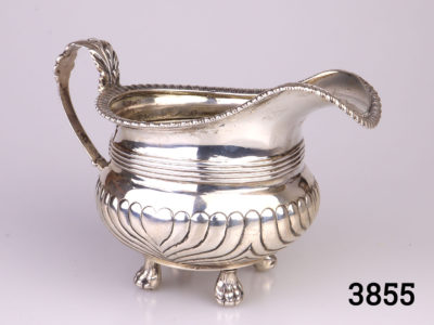 c1815 Edinburgh assayed sterling silver footed milk jug. Fully hallmarked to the base. Made by John McDonald. Base measures 50mm square Main photo of whole jug with handle to the left