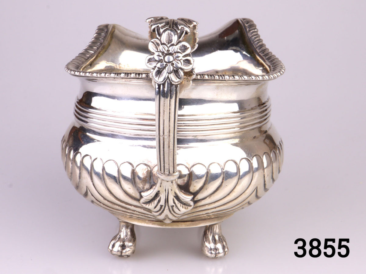 c1815 Edinburgh assayed sterling silver footed milk jug. Fully hallmarked to the base. Made by John McDonald. Base measures 50mm square Photo of handle