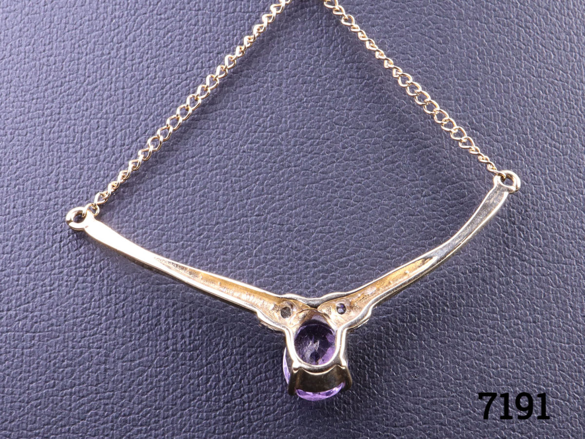 9 karat gold necklace with attached 9 karat gold and oval cut amethyst and diamond pendant. Pendant measures 40mm wide Close up of back of pendant