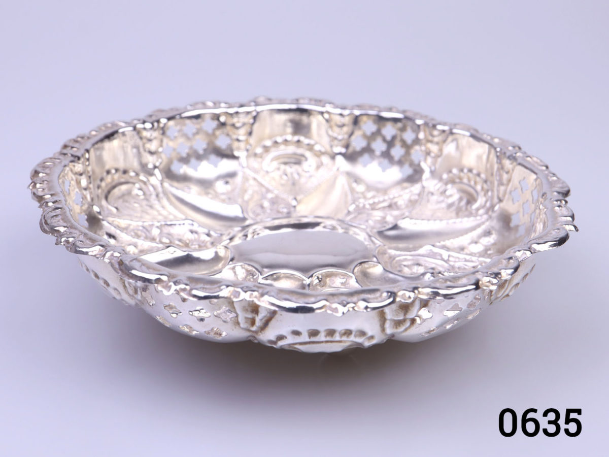 c1902 Birmingham assayed pair of small sterling silver finely decorated and embossed footed bowls. Each measure 118mm in diameter