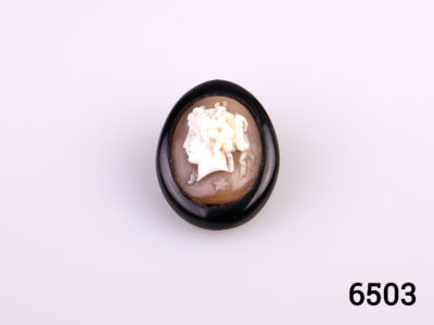 Petite Victorian oval cameo brooch set on Whitby jet with a brass back. Small chip on jet at back of brooch which is not visible from the front. Main photo showing front of brooch