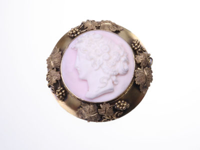 Victorian carved pink conch shell cameo of a lady in rare ornate mount decorated with grapes and vines in original box Not hallmarked but tests for 18karat gold 13.8 grams 43mm in diameter Main photo showing brooch front view on