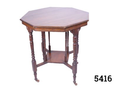 Victorian hexagonal side table in mahogany with a lower square ledge and original castors. Some signs of wear. Table top measures 715mm in diameter. Base measurement at legs 440mm square. Bottom ledge measures 265mm square Main photo showing entire table from a slightly raised angle