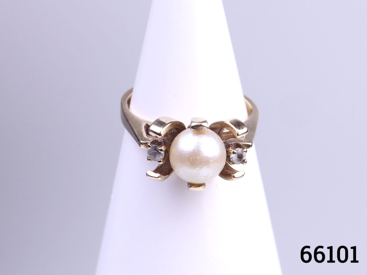 Vintage 10 karat gold courtship ring with pearl and diamonds. Size K / 5.25 Weight 3.6g Main photo of ring displayed on a stand showing ring front with pearl and diamonds