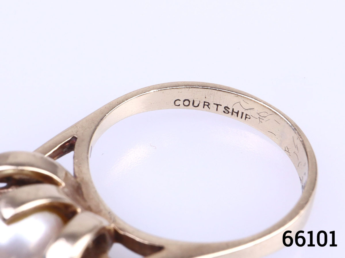 Vintage 10 karat gold courtship ring with pearl and diamonds. Size K / 5.25 Weight 3.6g Close up photo of the inner band showing 'courtship' wording