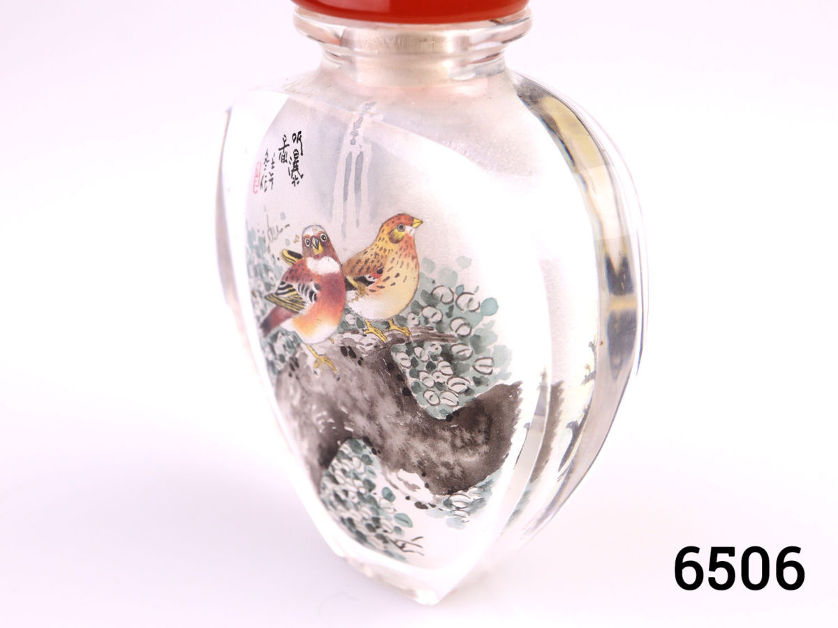 Vintage Chinese inside painted snuff bottle by Yuan Zi entitled "News of Spring". Decorated with birds on trees on both sides. Carnelian stone stopper. Photo of bottle at a slight aide angle