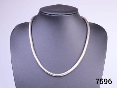 Vintage solid silver chunky snake chain necklace. (Not hallmarked but tests for silver)The 3 links on the end of chain added for extension is not silver. Danish make. Main photo showing necklace front displayed on stand