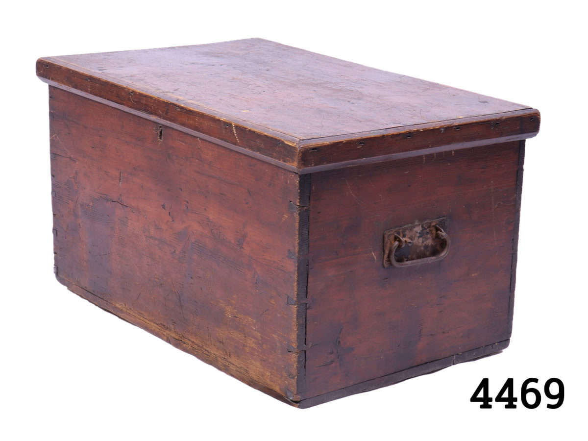 Vintage small dark stained pine box with dovetail joints. Iron handles to either side and lock without key (lock needs securing) Measurement at base 520mm by 320mm Photo of box from a slight side angle showing one handle