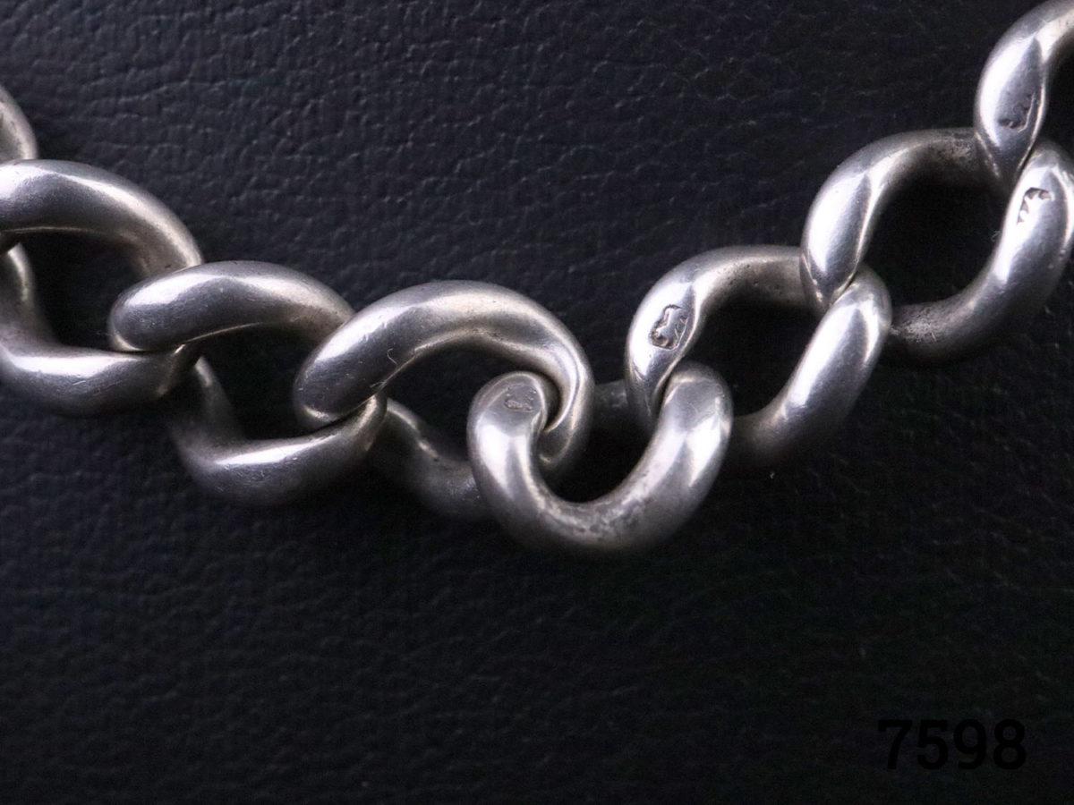 c1886 Victorian heavy solid sterling silver Albert fob watch chain. Lion passant hallmark on each link and on the T-bar Close up photo of the chain link showing the lion passant hallmark