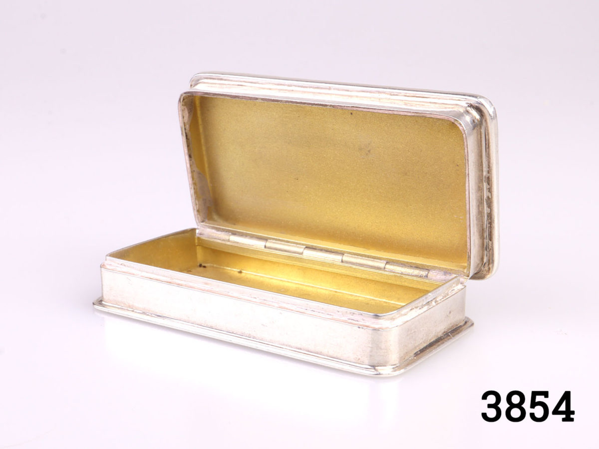 c1986 Birmingham assayed solid sterling silver pill/snuff box with gilt interior. Full hallmark on the inside (Burghley House in Lincolnshire on the lid) Photo of box with lid open showing the gilt interior on the lid