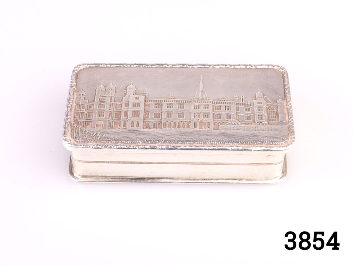 c1986 Birmingham assayed solid sterling silver pill/snuff box with gilt interior. Full hallmark on the inside (Burghley House in Lincolnshire to the lid) Main photo of the box shown from a slight raised angle looking at the building on the lid
