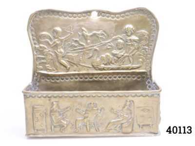 18th century Dutch brass candle box. Intricately decorated with embossed fireside scene to the base and cherubs at the top. Main photo of box shown from the front
