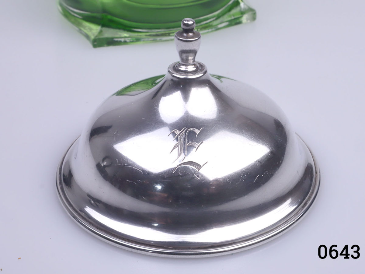 Vintage American silver lidded glass pot. Unusual shaped pot with square base and circular top with green tint to the base. Monogrammed with the letter E to the top of the lid. Base measures 65mm square and top opening measures 62mm in diameter Close up photo of the monogram on the lid