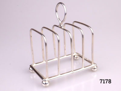 Antique sterling silver toast rack with ball feet. Fully hallmarked for Chester assay c1904 by maker J.J (Probably James Charles Jay) Main photo showing toast rack from a slight side angle