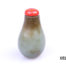 Antique 19th century snuff bottle. Green and brown colour with red lid.. Simple classic pear shape. Stands upright. Main photo showing upright bottle with red stopper in place