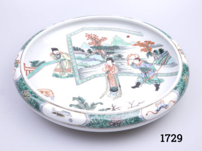 Vintage Chinese Famille Verte porcelain dish. Rolled rim and decorated with figures standing in front of panel screen. Six character mark to the base. Measures 190mm in diameter at base and 275mm in diameter across the top. Main photo showing entire dish from a raised angle showing the whole decorative scene