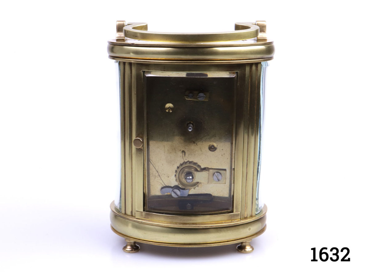 Early 20th century timepiece in oval case. Inscription at base dated 1931. In excellent working order. Key included. Fully serviced and guaranteed for 1 year from date of purchase. Photo of back of clock