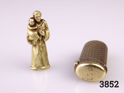 Early 20 century Tiffany & Co 14kt gold charm and case. 14kt gold charm of St. Anthony and herringbone patterned case. Stamped Tiffany & Co to the base of case and with initials L.S.D on lid. 14kt hallmark on inside of case lid and base of charm. Charm & case weighs 4.3g Case measures 24mm high and 10mm wide and 5mm deep Photo of St Anthony standing next to the case showing the initials L.S.D on case