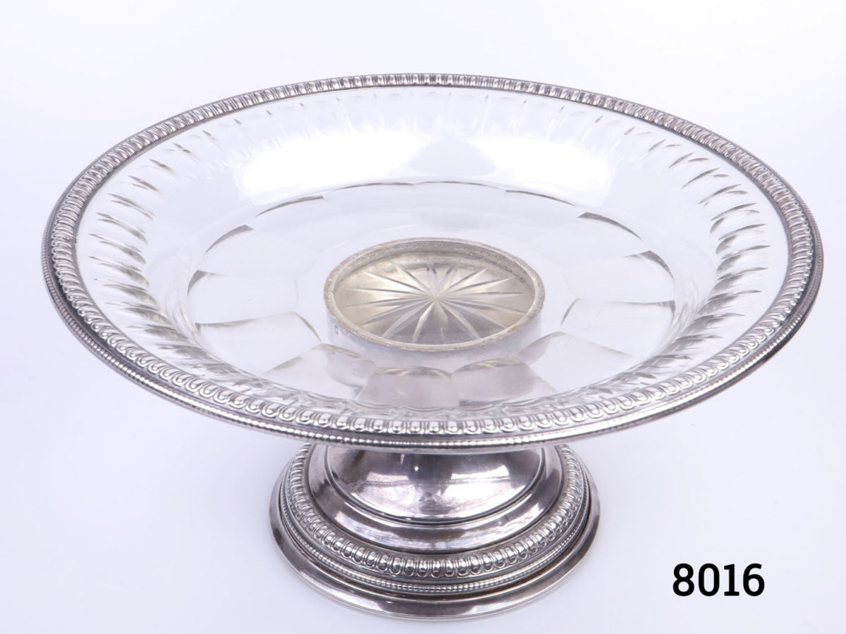Antique French silver and glass tazza. Hallmarked just under plate at top of base stand column Measures 107mm in diameter at base & 215mm in diameter across top. (Some chips on the glass below the top outer rim) Photo of tazza from a raised angle showing glass top and base of column