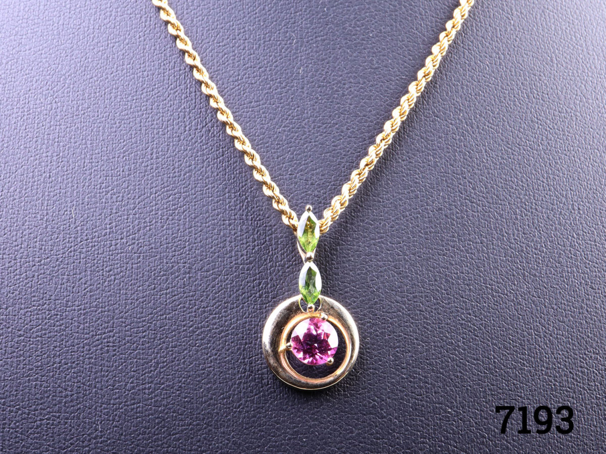 9 karat gold necklace with pink tourmaline and peridot pendant. Both necklace and pendant will full hallmarks. Pendant measures 23mm long Close up photo of the pendant seen from a front view
