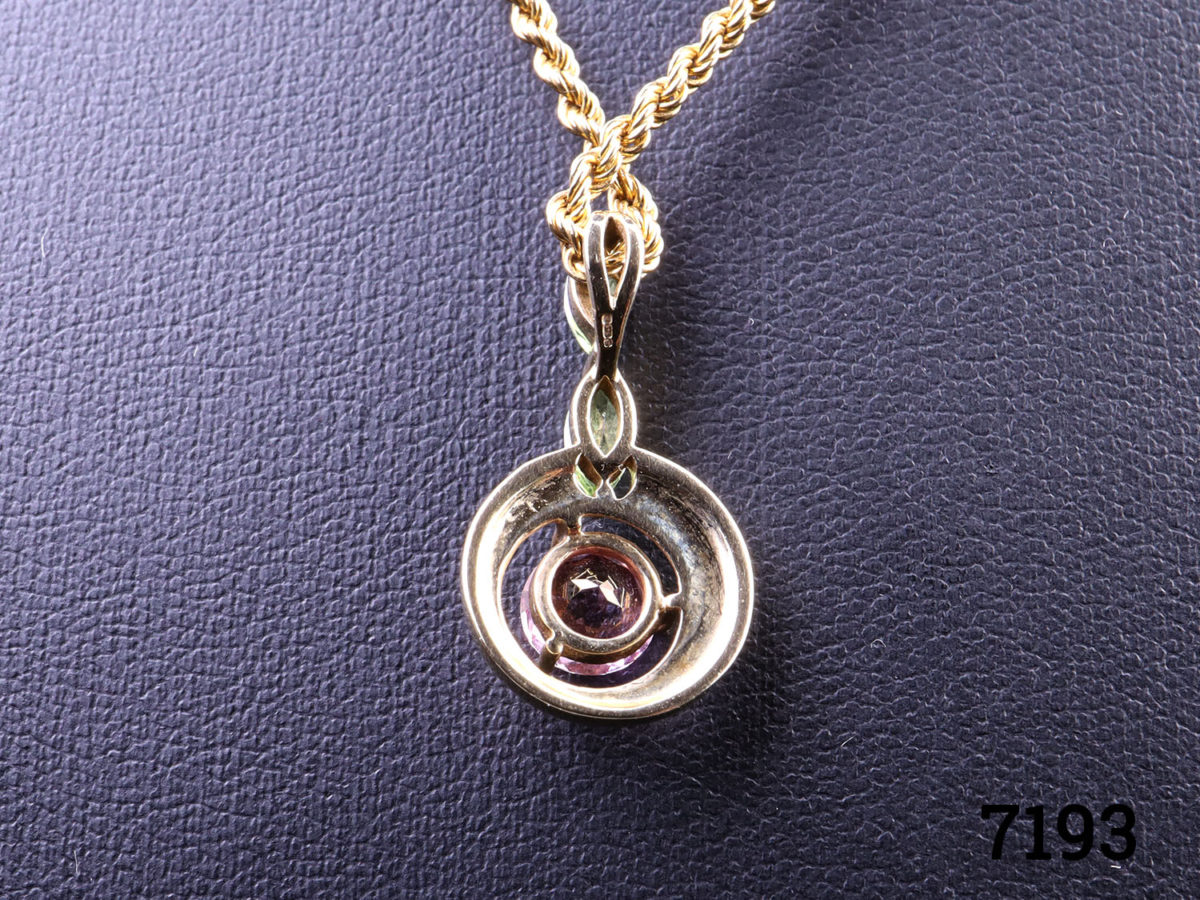 9 karat gold necklace with pink tourmaline and peridot pendant. Both necklace and pendant will full hallmarks. Pendant measures 23mm long Close up photo of the back of pendant showing hallmark on bail