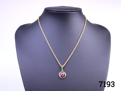 9 karat gold necklace with pink tourmaline and peridot pendant. Both necklace and pendant will full hallmarks. Pendant measures 23mm long Main photo showing necklace displayed on stand
