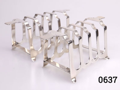 Pair of Art Deco sterling silver toast racks. Fully hallmarked for c1938 Birmingham assay. Each measures 112mm long across the top 50mm at widest point and 52mm tall. Main photo showing both toast racks side by side from a slightly angled view