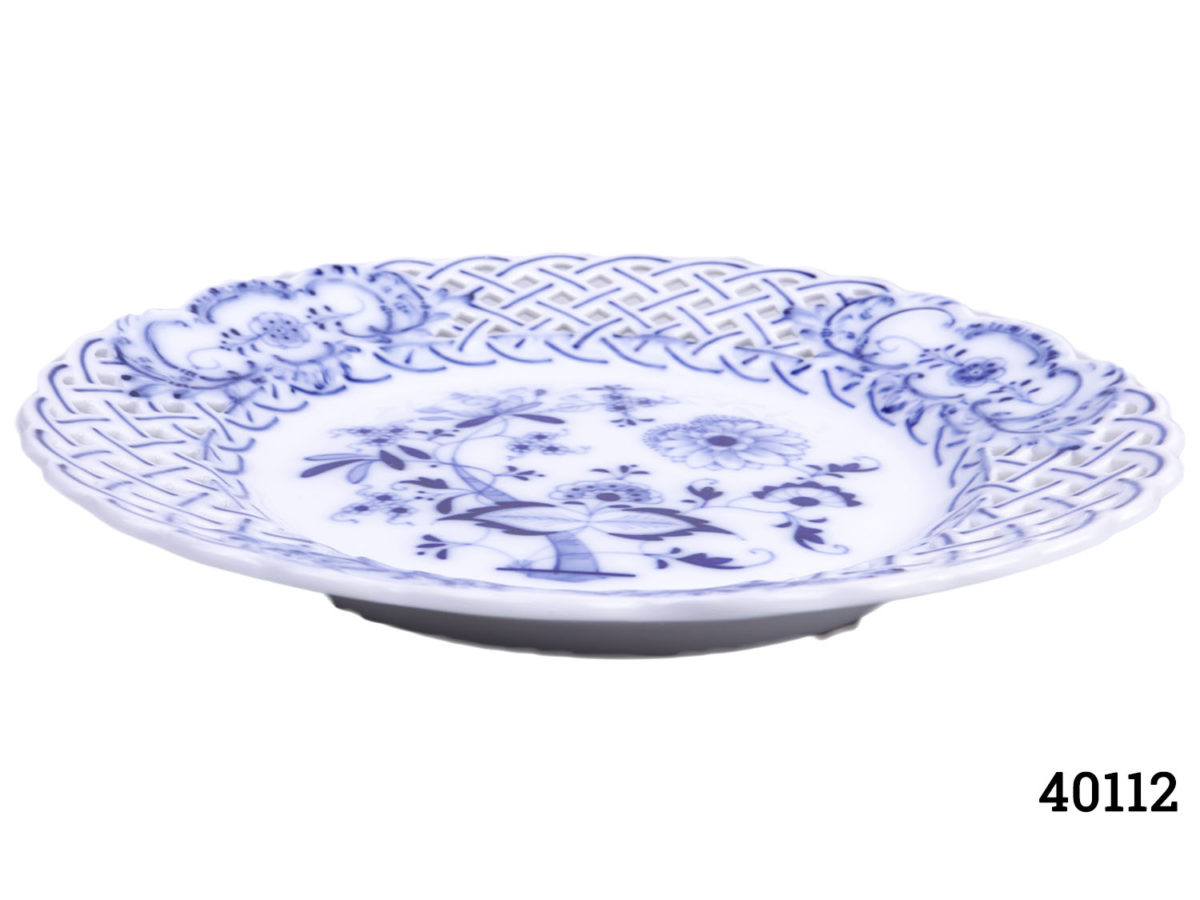 Pair of blue and white pierced dishes by Saxe Each dish measures 130mm in diameter at base, 215mm in diameter at top and 30mm high. Photo of one dish on a flat surface showing partial depth