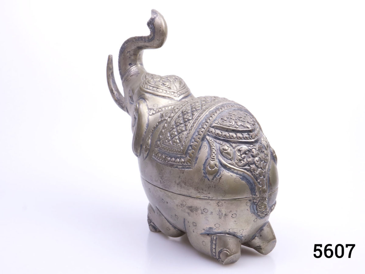 Genuine pre-1920s pair of Cambodian silver elephant condiment and mouth freshener containers. Large elephant measures 160mm at longest point, 70mm at widest and 145mm tall with hallmark of T900 to the belly Small elephant measures 85mm at longest point, 40mm at widest and 80mm tall with no visible hallmark. Photo of larger elephant from behind