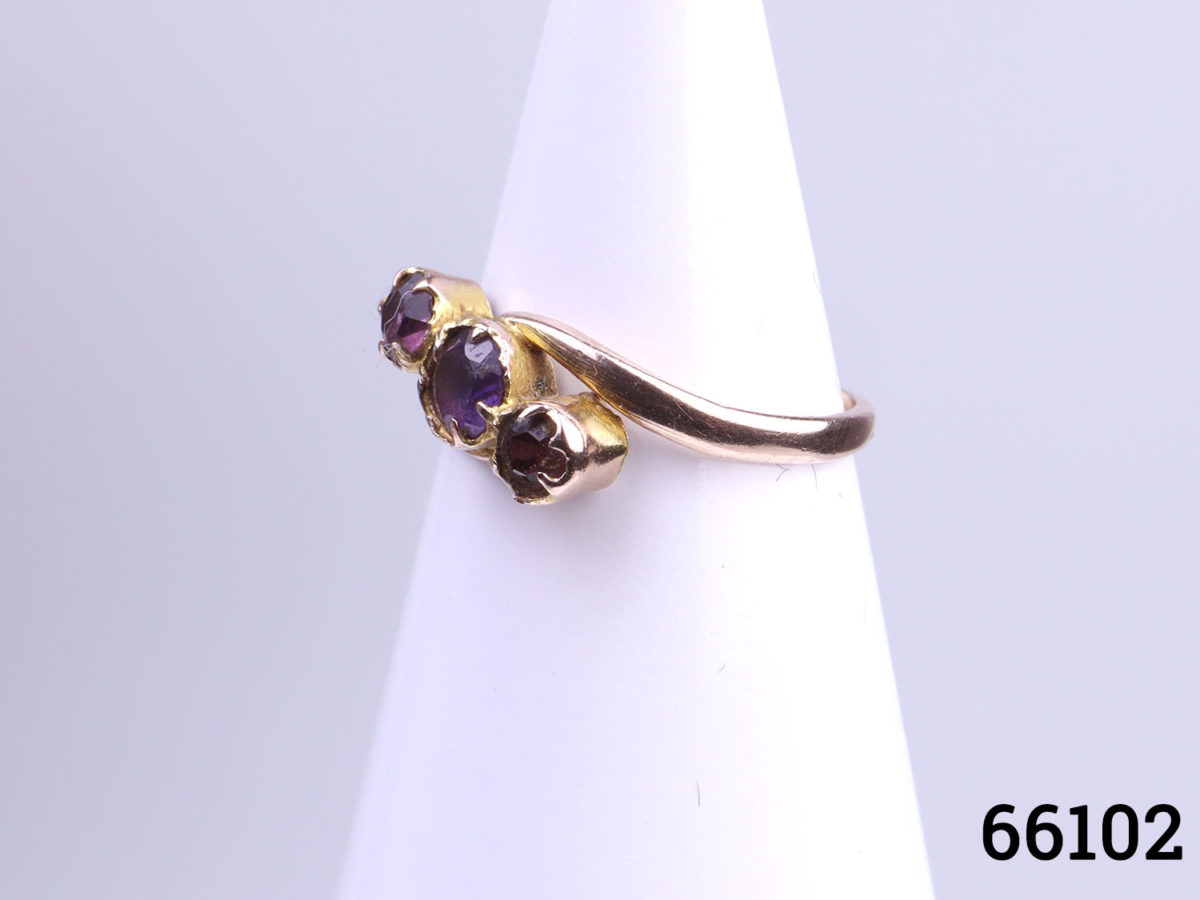 9 Karat rose gold and round cut amethyst trilogy ring. Size J / 4.75 Ring weight 1.4g