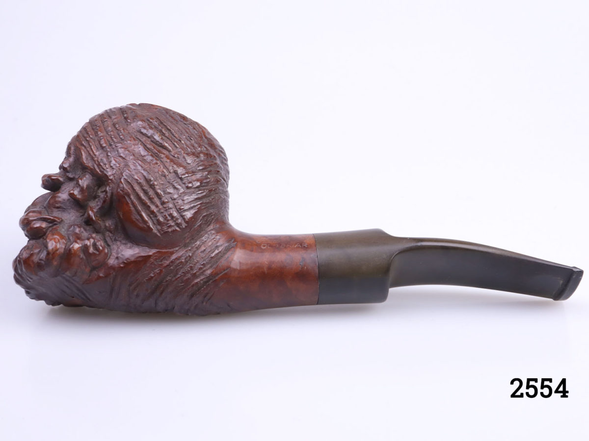 Vintage carved wooden smokers pipe with the head of an Eastern gentleman at the bowl. Marked Red Point Old Briar to the side. Head at bowl measures 55mm long by 48mm wide (at top) and 66mm high Photo of pipe from other side with head to the left