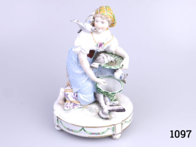 Vintage Continental porcelain figurine of a young lady feeding pigeons from a basket. No makers mark but numbered 1715 to base. Possibly German. (Some gilt wear to the base) Main photo showing lady facing forward and from a slight raised angle