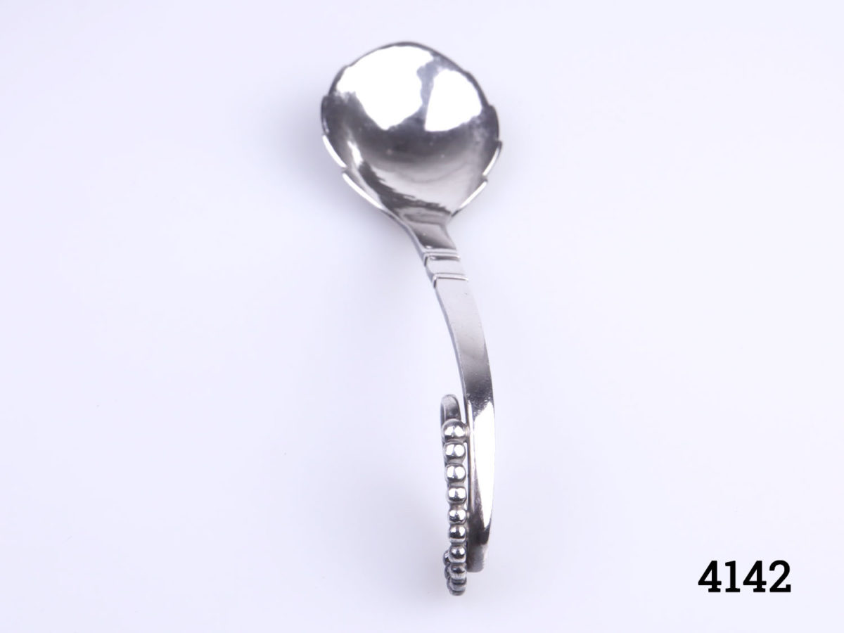 Vintage stylised sterling silver spoon by Georg Jensen c1930-45. Spoon bowl measures 38mm long by 35mm Photo of spoon with handle end to the fore