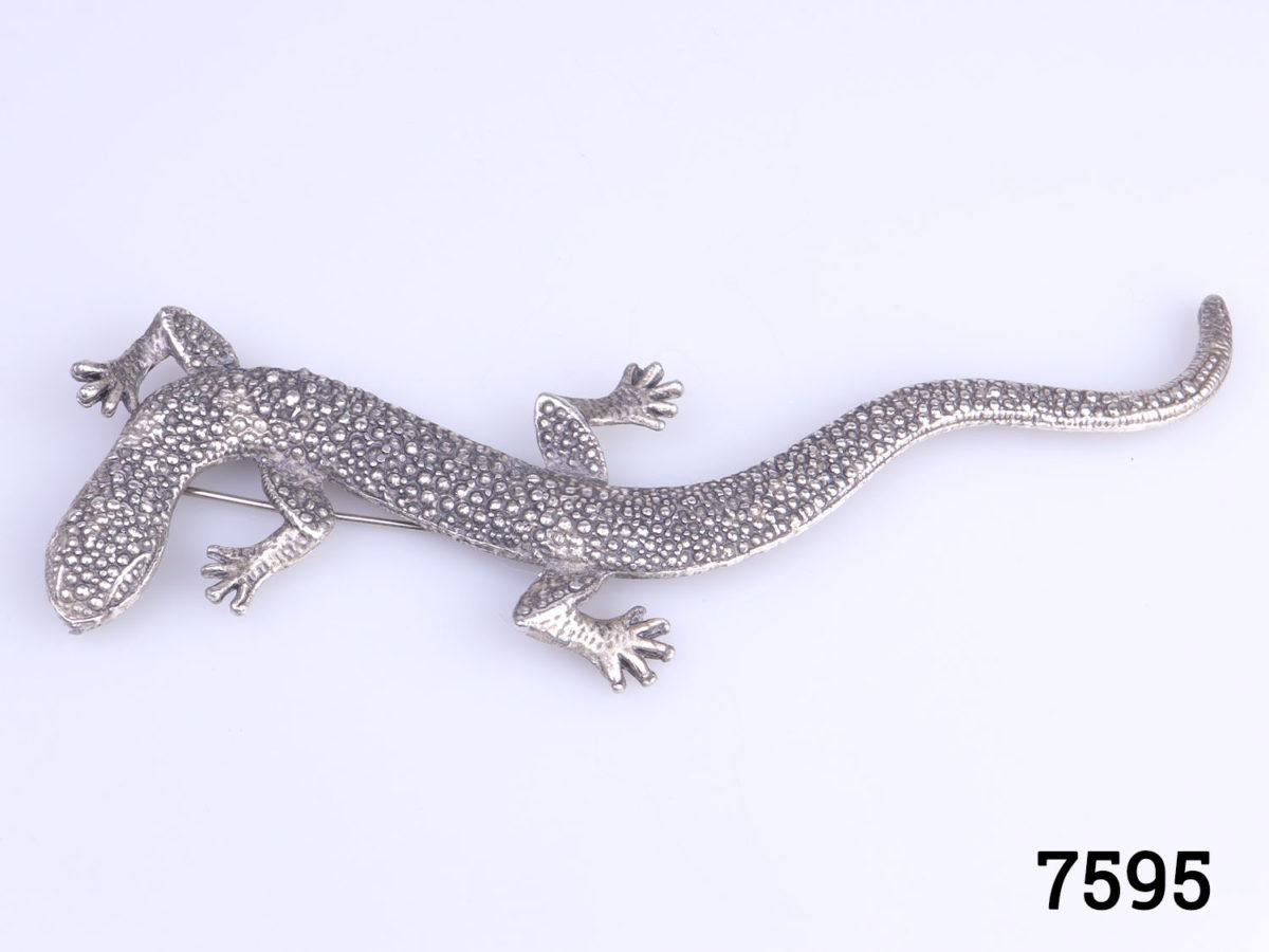 1980s vintage large silver metal lizard brooch with a scaly pattern. Statement piece for accessorising a coat or jacket lapel. Widest points measures 40mm Main photo of lizard looking straight down displaying as it would be worn