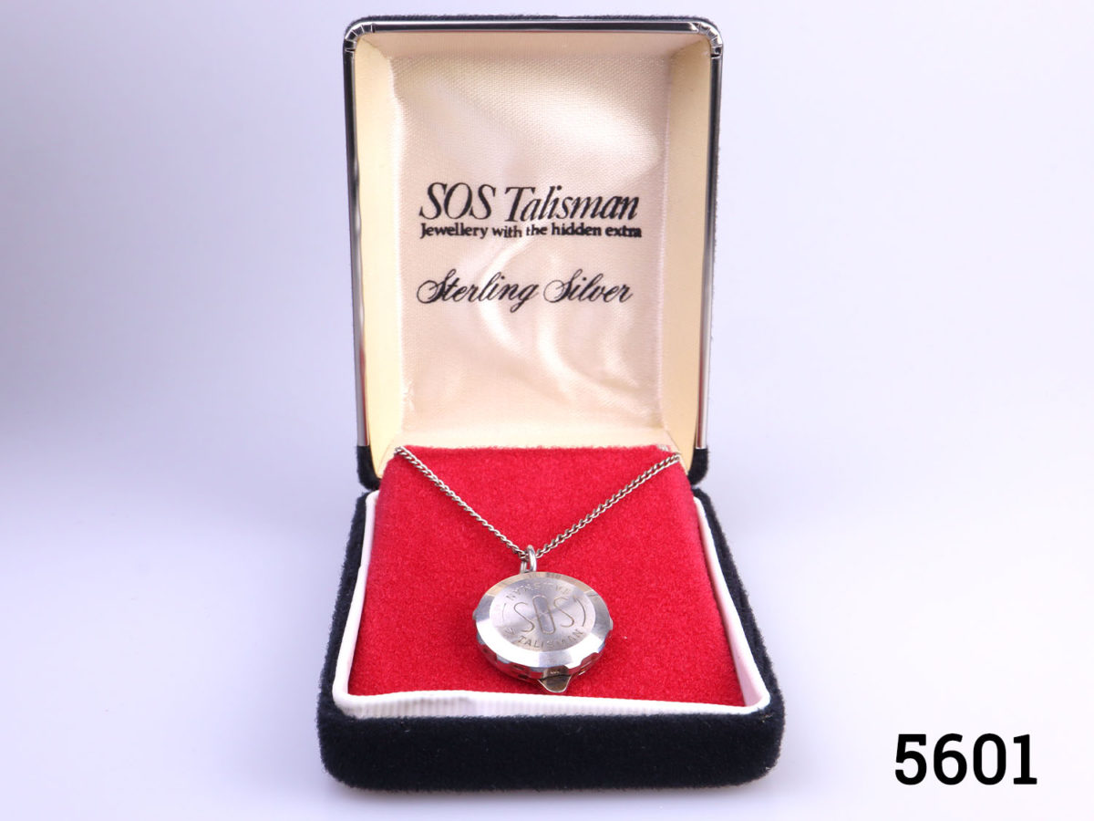 Vintage sterling silver SOS Talisman locket on sterling silver chain. Fully hallmarked 925 for sterling silver. Comes in original box complete with original blank certificates to add specific medical requirements or notes and a catalogue. Locket and chain weigh 12.5 grams. Locket measures 22mm in diameter. Chain measures 500mm long. Main photo of the necklace in original case