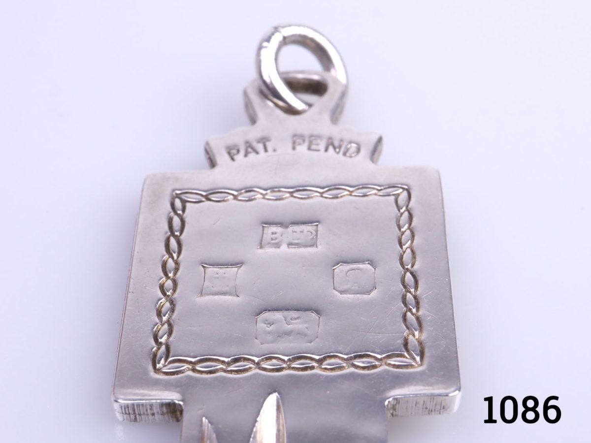 Vintage sterling silver coming of age key inscribed with 21 on one side and hallmark on the reverse. Fully hallmarked for Birmingham assay c1978 Close up of hallmark