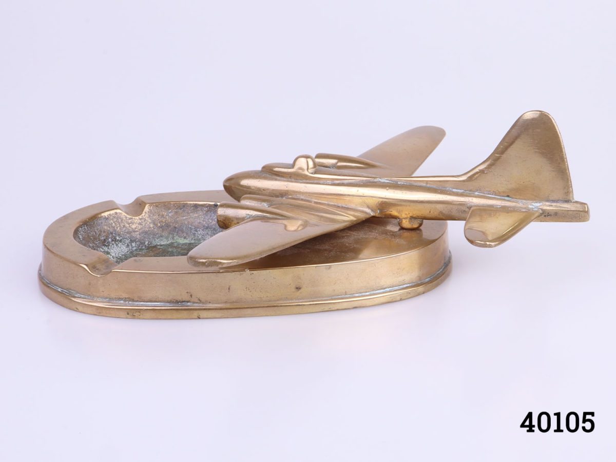 Original WWII solid brass B17 Flying Fortress ashtray. Ashtray measures 155mm by 98mm Aircraft measures 145mm long by 220mm wide across the wings and 70mm tall at highest point by the tail Another side angle photo