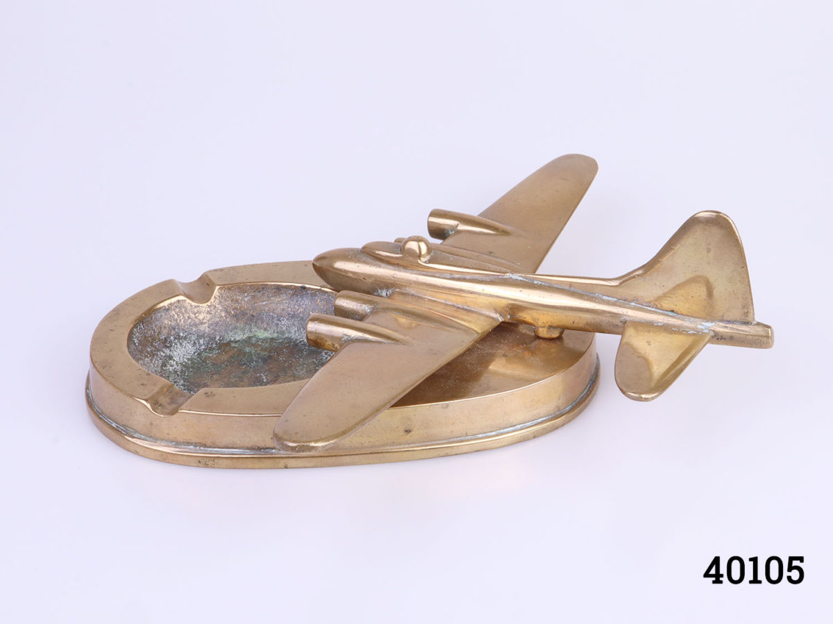 Original WWII solid brass B17 Flying Fortress ashtray. Ashtray measures 155mm by 98mm Aircraft measures 145mm long by 220mm wide across the wings and 70mm tall at highest point by the tail Photo of ashtray showing side of the aircraft