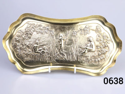 c1901 London assayed gilt silver oblong dish. Decorated with embossed scene of a family playing by the river bank with reeds and brambles. Fully hallmarked for sterling silver and made by William Comyns & Sons Main photo of dish on a display stand showing full embossed decoration
