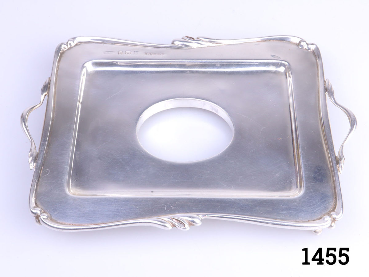 c1907 Birmingham assayed sterling silver and cut glass inkwell and stand. Inkwell sits securely in the hole in the centre of the stand. Inkwell weighs 190.6grams and measures 52mm x 45mm and 70mm tall. Stand measures 150mm long (including handles) and 110mm wide and weighs 95grams Photo of tray only showing hole where inkwell sits