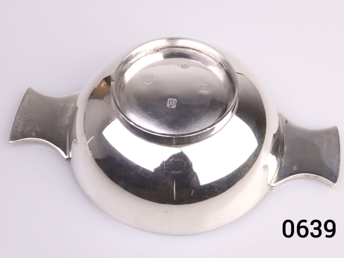 c1967 Edinburgh assayed sterling silver 2 handled Quaich drinking cup with Celtic design on the handles. Base measures 45mm in diameter. Photo of the cup upside down showing hallmark