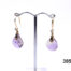 Unique 18 karat gold dangle earrings set with carved amethystine and small diamond. Hallmarked 18k for 18 karat gold. Drop length 40mm. Amethystine is a hybrid of amethyst and citrine. Stone measures 12mm at widest point. Main photo with both earrings shown on display stand