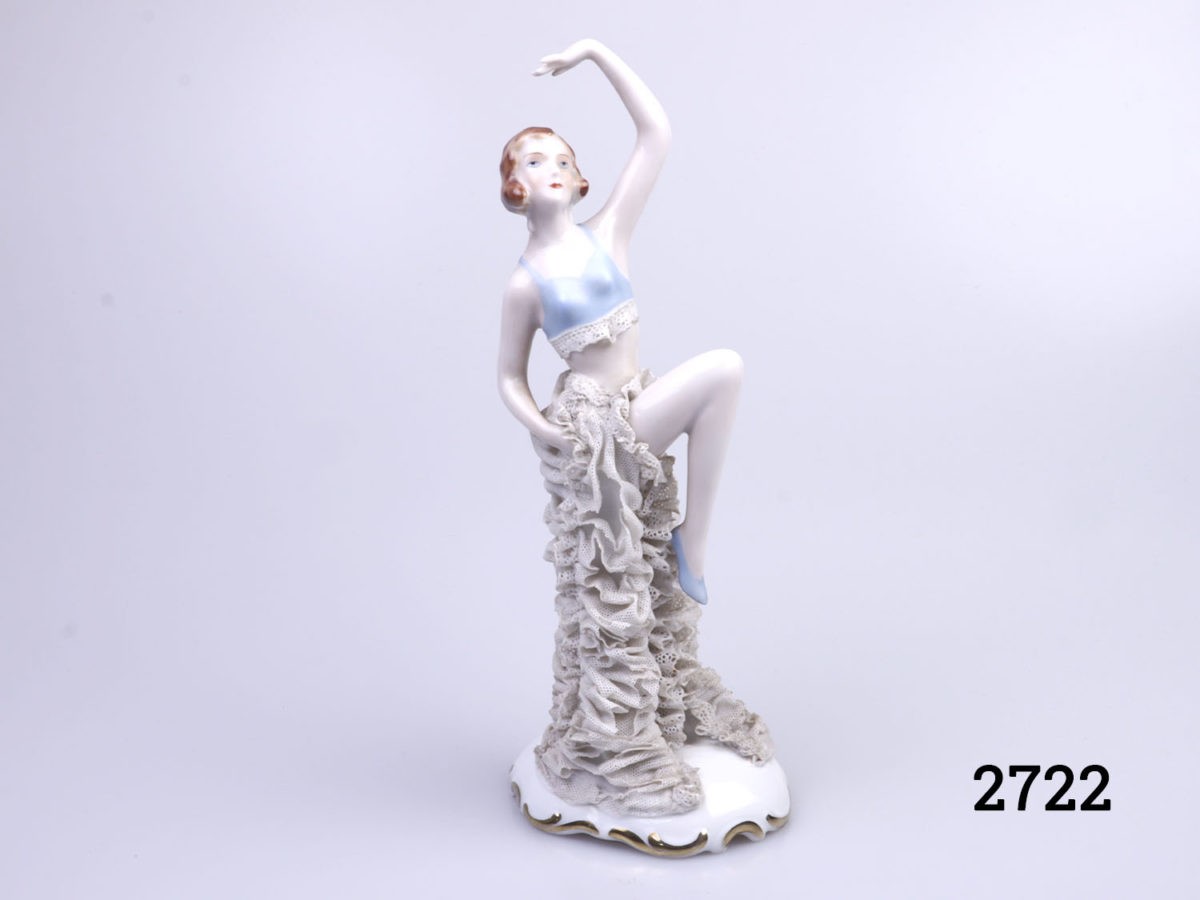 1930s porcelain figure of a dancing girl. Lace detail to pale blue top and long ruched skirt. Main photo showing dancer from the front